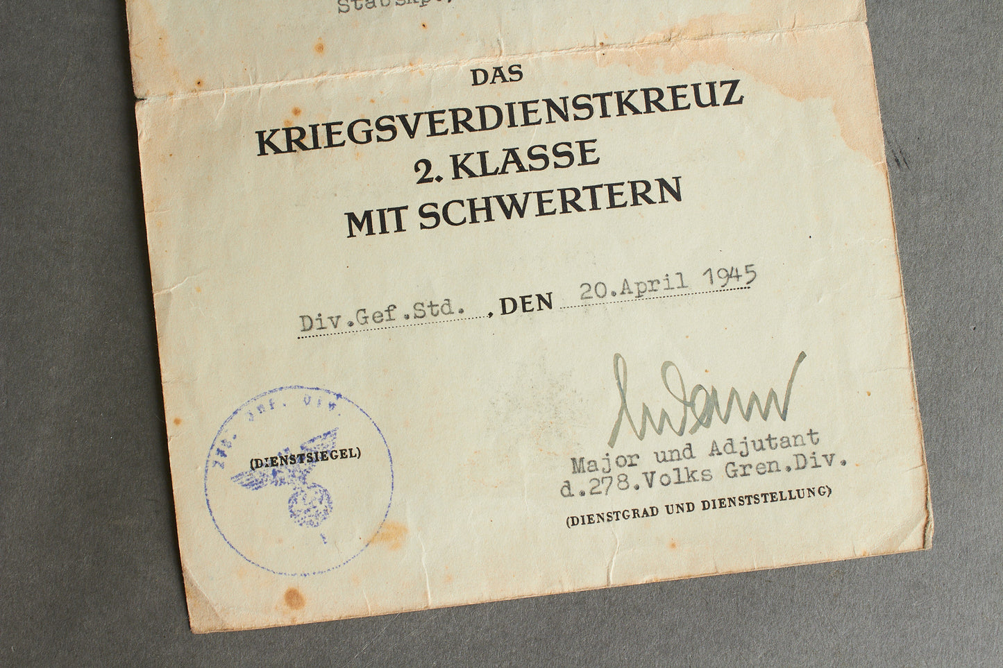 Awarded on Hitlers birthday 20th of april 1945. "Kriegsverdienstkreuz 2. Klasse" w. Swords Urkunde. Original.