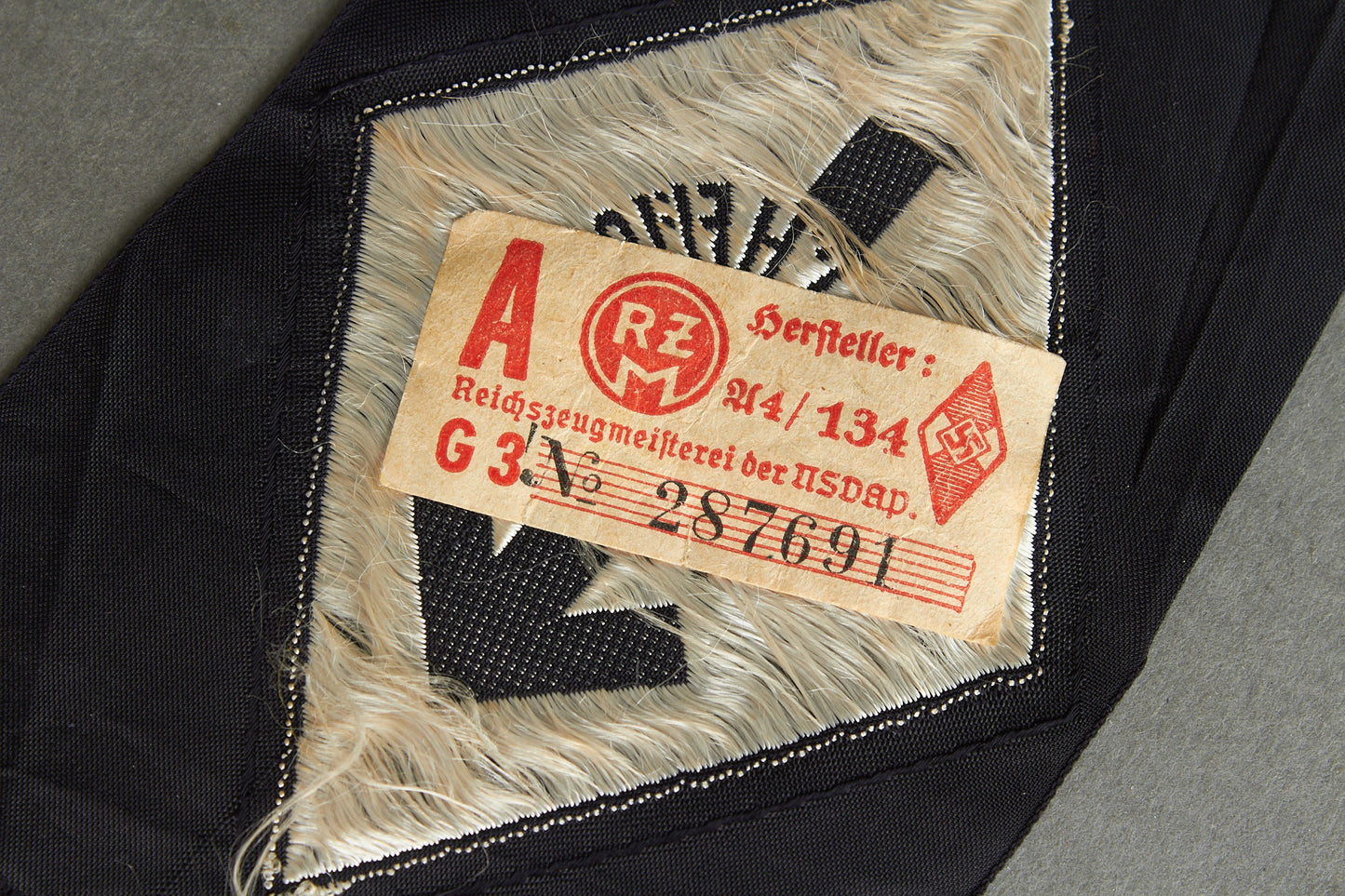 HJ (Hitler Jugend) "HJ-Leistungsabzeichen in Silber" on black cloth. With RZM Tag. Original.