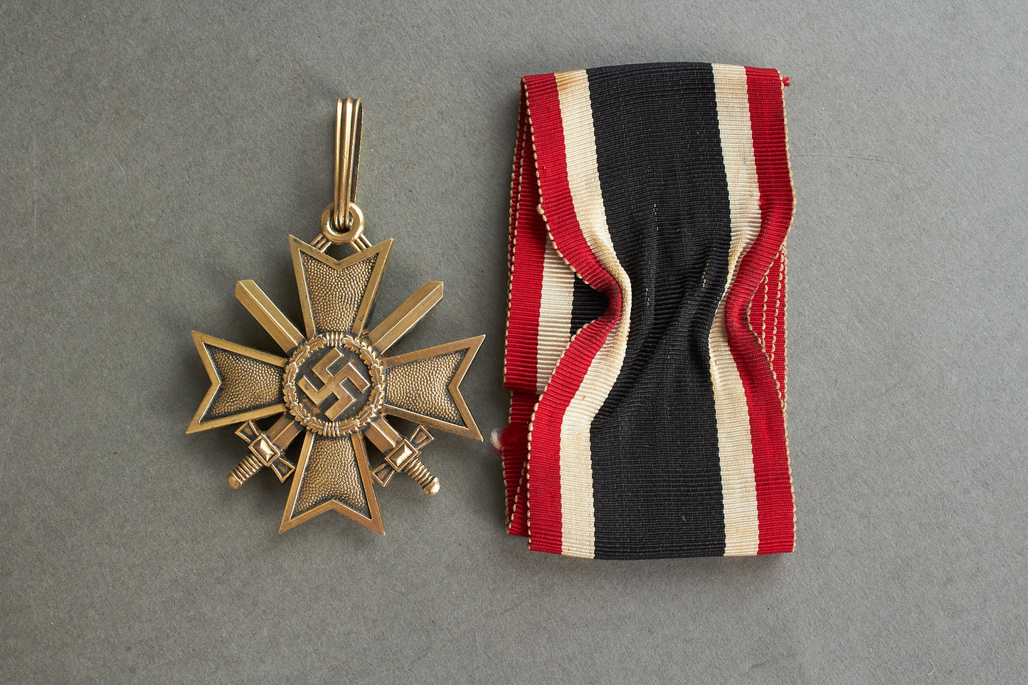Souval made (after '45) Ritterkreuz des Kriegsverdienstkreuz in real silver. Original Ribbon. Good substitute for a wartime made!