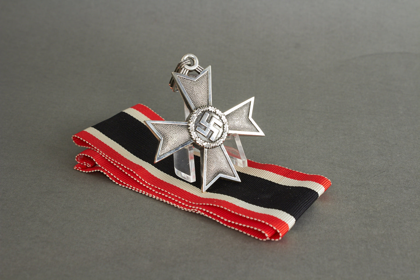 Souval made (after '45) Ritterkreuz des Kriegsverdienstkreuz in real silver. Original Ribbon. Good substitute for a wartime made!