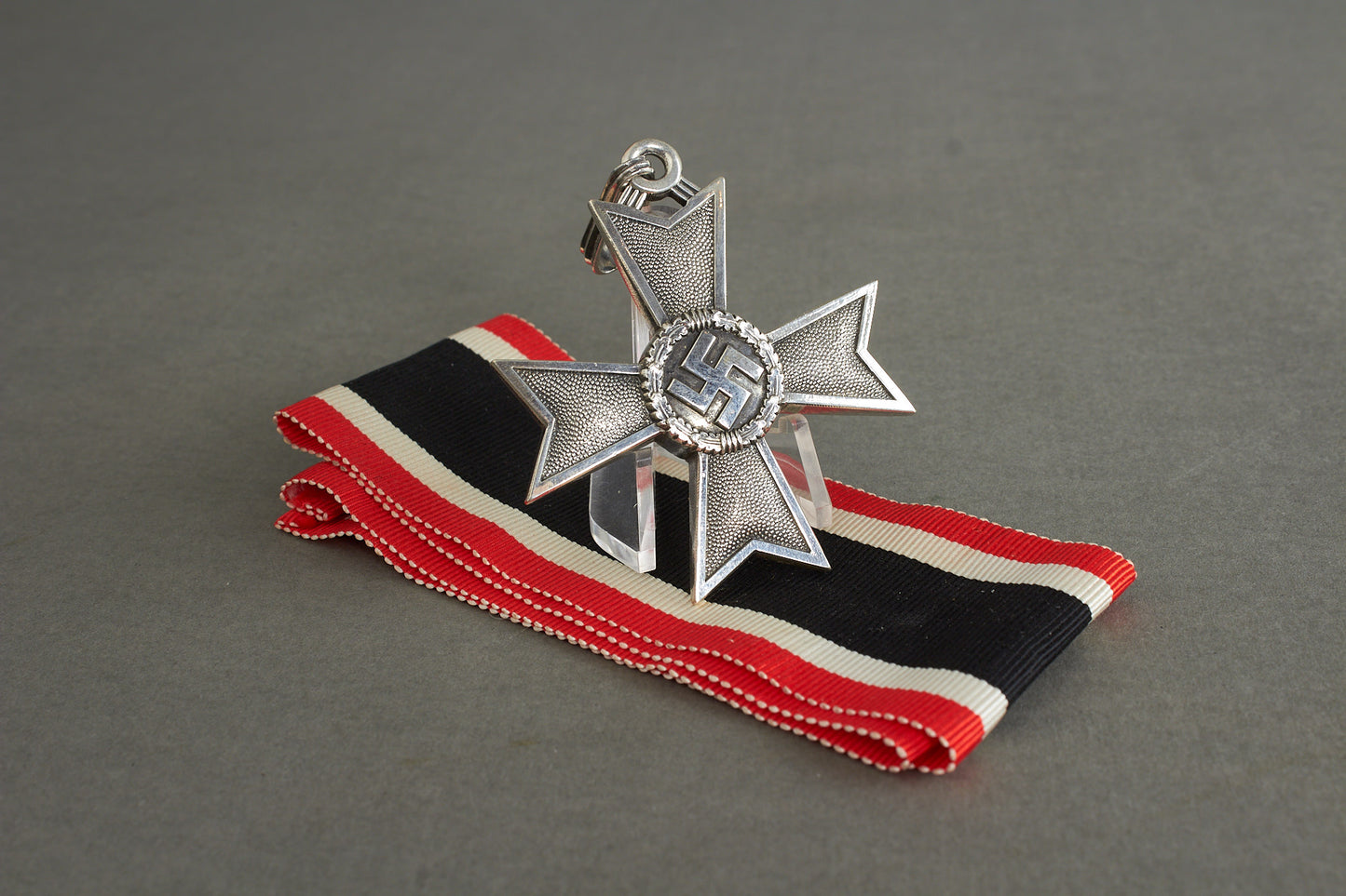 Souval made (after '45) Ritterkreuz des Kriegsverdienstkreuz in real silver. Original Ribbon. Good substitute for a wartime made!