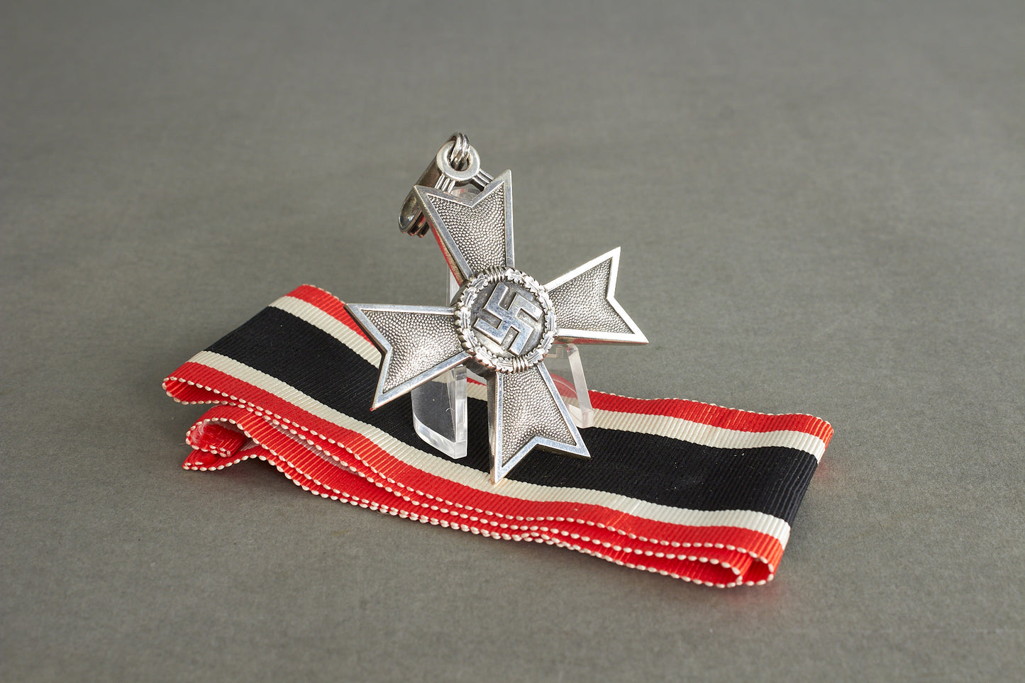 Souval made (after '45) Ritterkreuz des Kriegsverdienstkreuz in real silver. Original Ribbon. Good substitute for a wartime made!