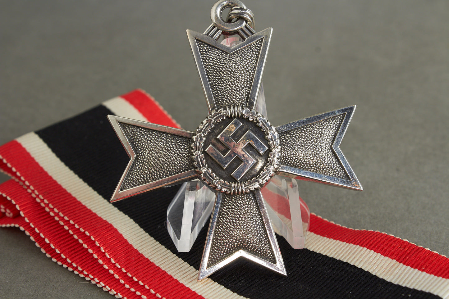 Souval made (after '45) Ritterkreuz des Kriegsverdienstkreuz in real silver. Original Ribbon. Good substitute for a wartime made!