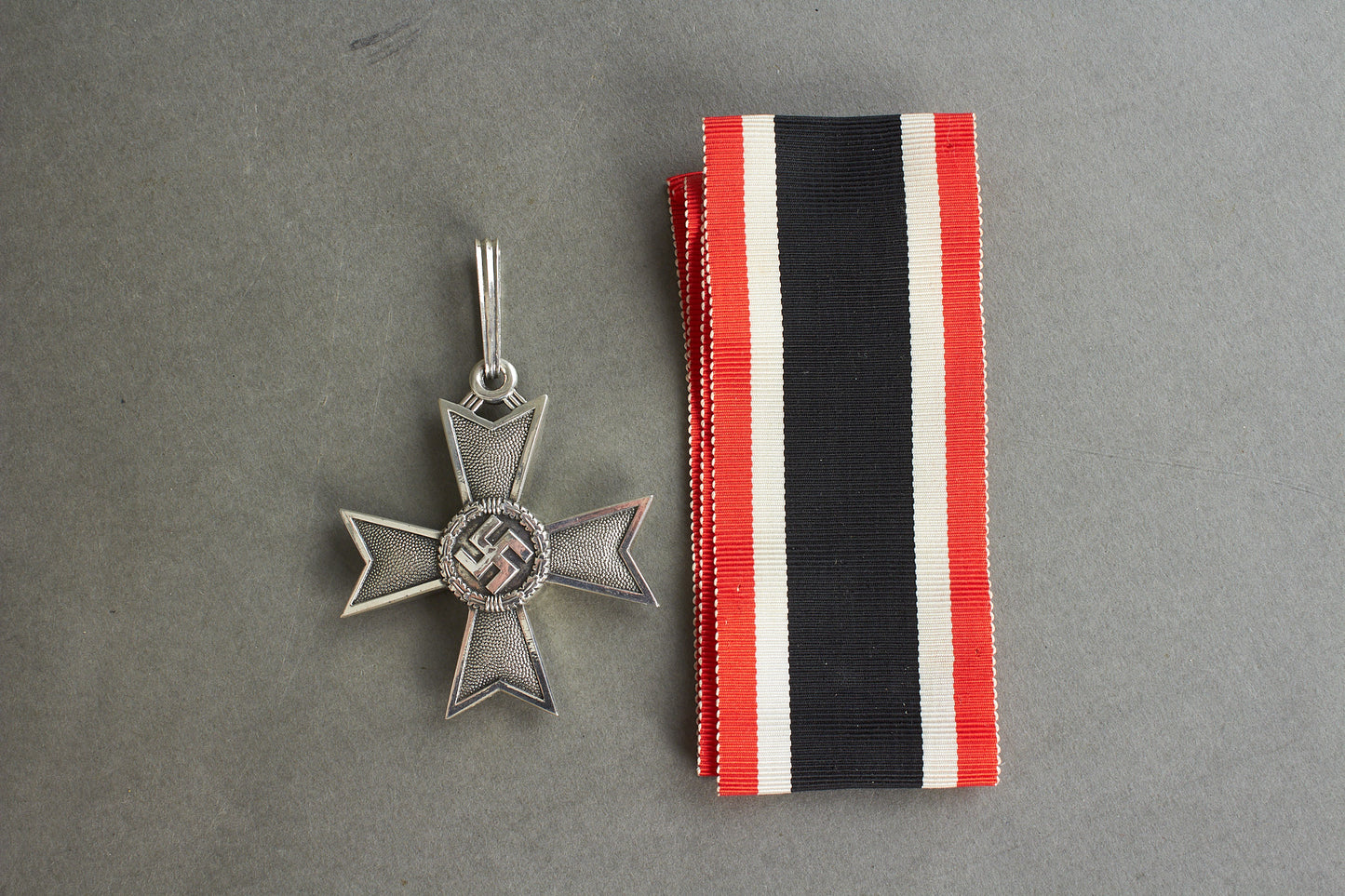 Souval made (after '45) Ritterkreuz des Kriegsverdienstkreuz in real silver. Original Ribbon. Good substitute for a wartime made!