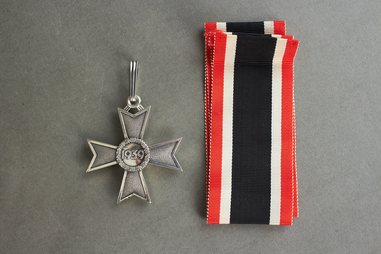 Souval made (after '45) Ritterkreuz des Kriegsverdienstkreuz in real silver. Original Ribbon. Good substitute for a wartime made!