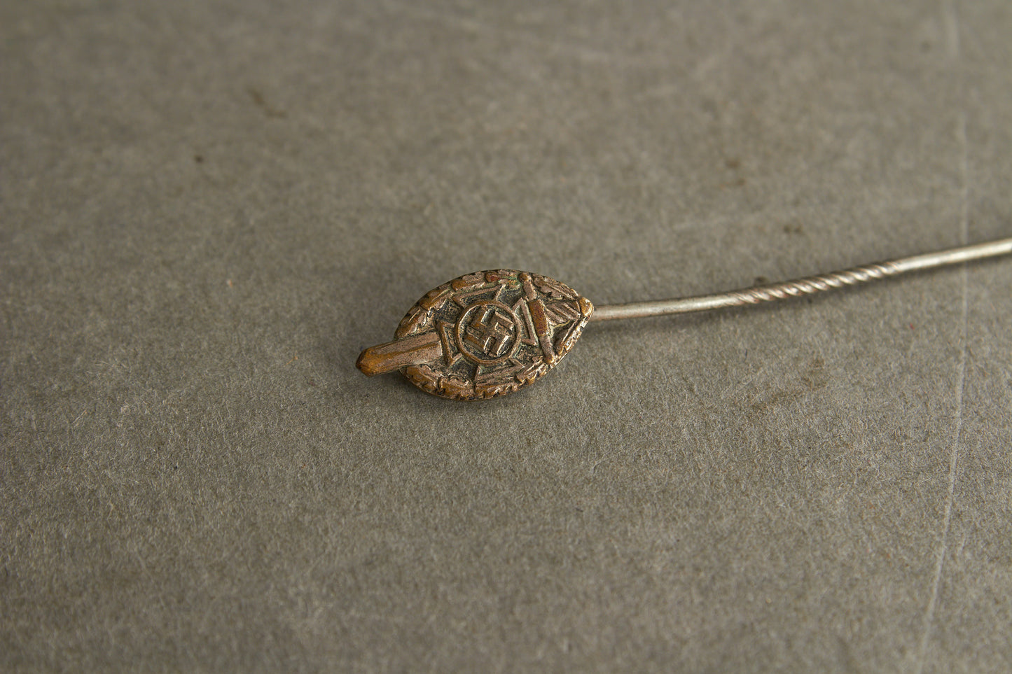 NSKOV (Nationalsozialistische Kriegsopferversorgung) Member pin. Maker marked "RZM 52". Original.