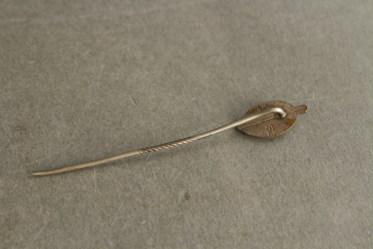 NSKOV (Nationalsozialistische Kriegsopferversorgung) Member pin. Maker marked "RZM 52". Original.
