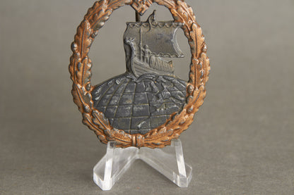 Kriegsmarine "Hilfskreuzer-Kriegsabzeichen". With initials "GK". Period made Rudolf Souval. Original.