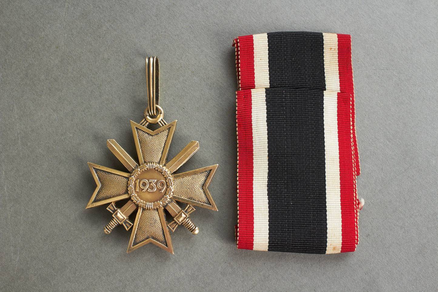 Souval made (after '45) Ritterkreuz des Kriegsverdienstkreuz in real silver. Original Ribbon. Good substitute for a wartime made!
