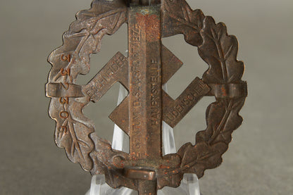 Numbered "SA-Sportabzeichen" in Bronze with miniature. 2. Model (1935-1938). Original.
