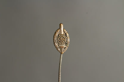 NSKOV (Nationalsozialistische Kriegsopferversorgung) Member pin. Maker marked "RZM 52". Original.