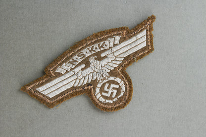 NSKK "Ärmeladler" For the "Braunhemd". With RZM Paper tag. Original.